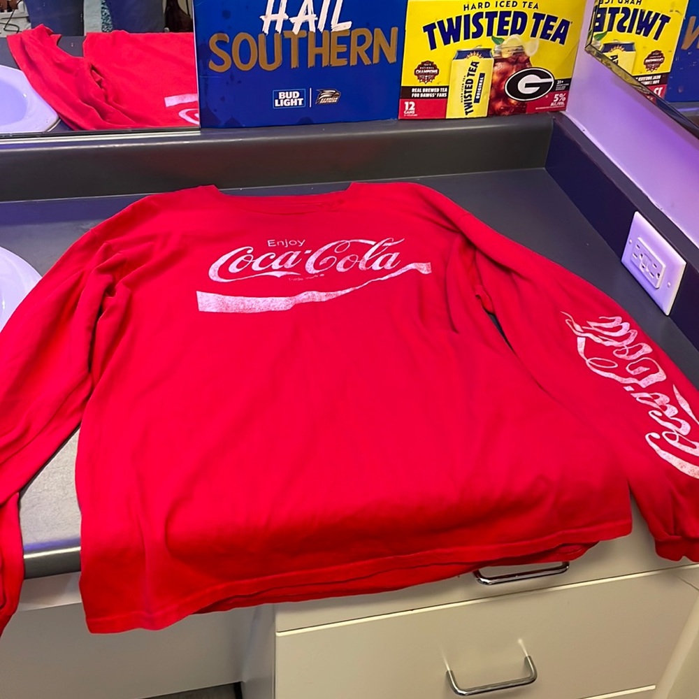 A red large long sleeve coca-cola shirt